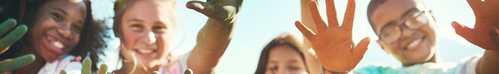 Children with their hands towards the camera