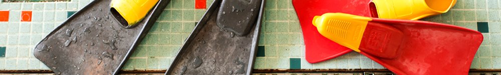 Swimming fins on the side of a pool